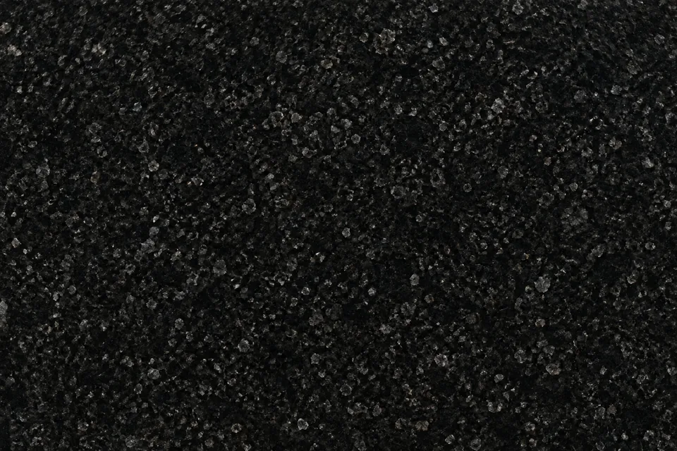 Textura preta de granito com pequenos grãos cinza